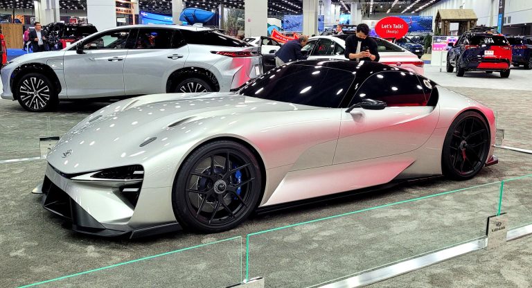 Lexus Electrified Sport concept displayed at an auto show, showcasing its futuristic design and low-slung profile