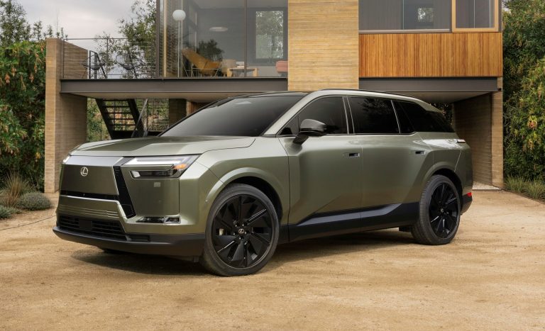 Olive-green Lexus luxury SUV parked outside a modern wooden-and-glass architectural home