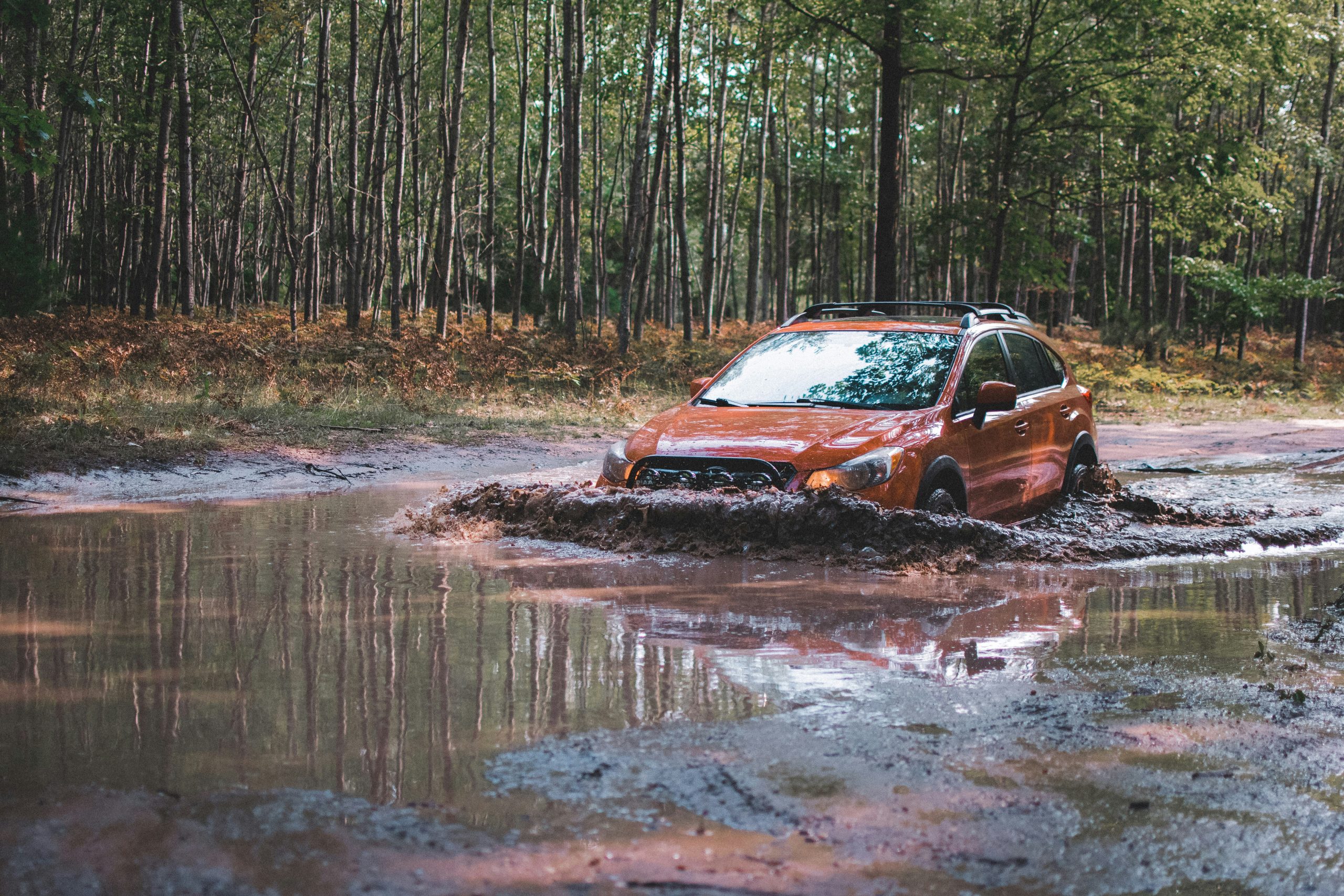 A Subaru Ascent is sailing in the muddy waters