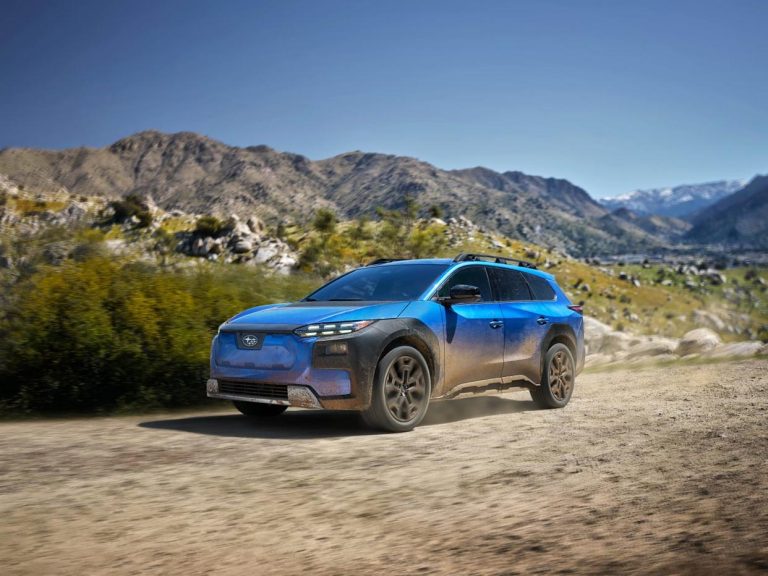 Subaru Electric Trailseeker driving along a rugged mountain trail, showcasing its all-electric adventure-ready design