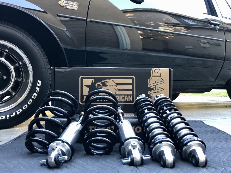 Many car springs and other components are kept in front of a car wheel