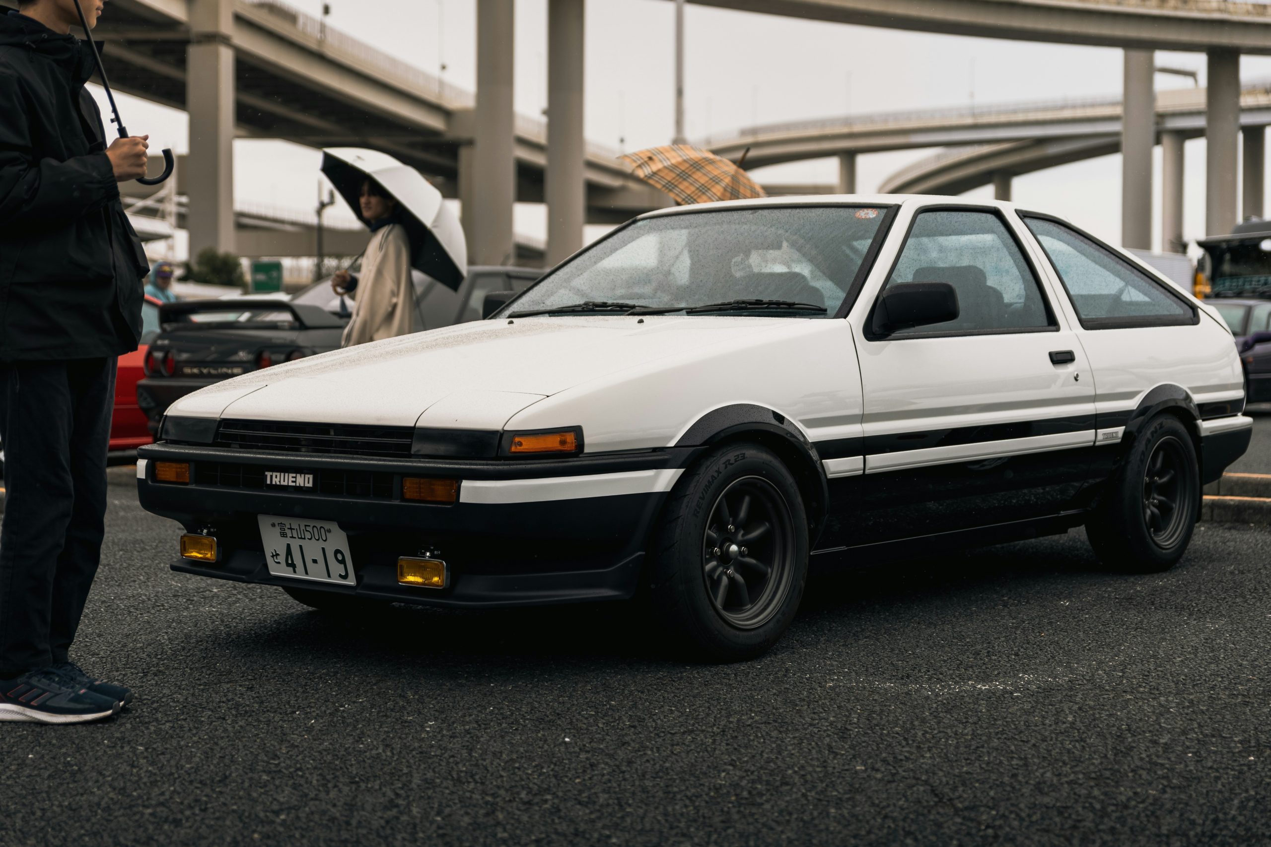 A vintage Corolla is shown with a subtle shade