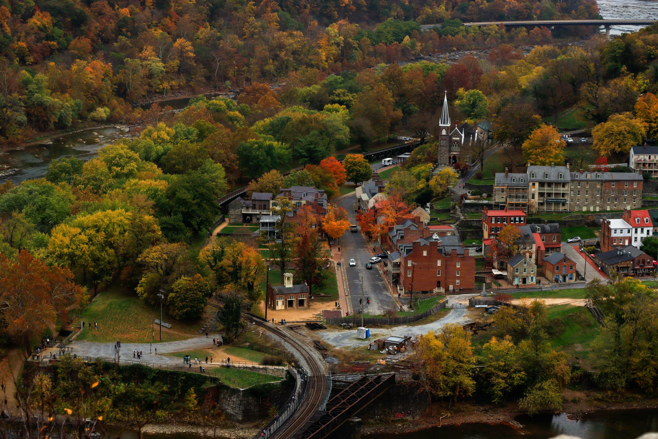 A locality of West Virginia is covered with trees and houses