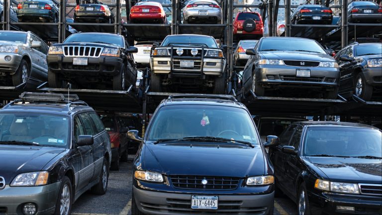 Stacked cars fill multi level parking garage in New York
