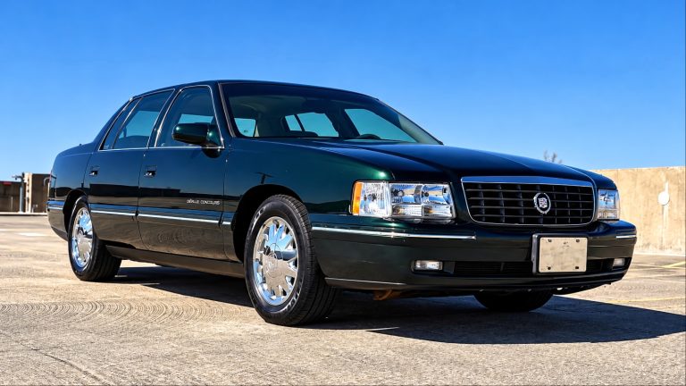 A Cadillac Deville is standing on a runway
