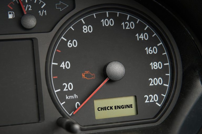 Car dashboard with the check engine light