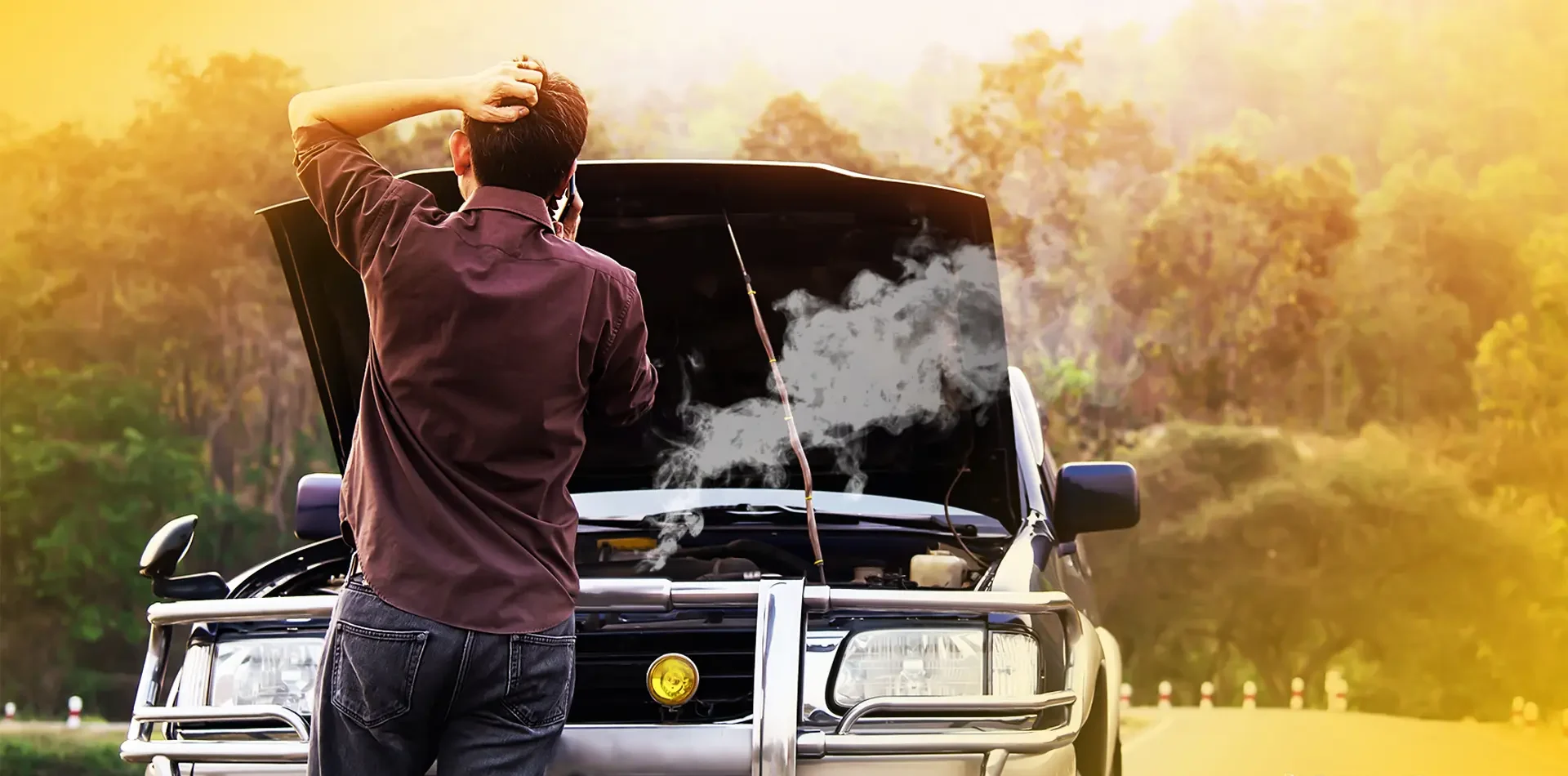 A man is frustated after the engine faliure of his car