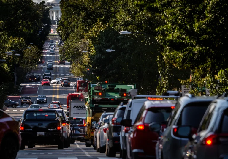 Many cars are stuck in the traffic on a main road