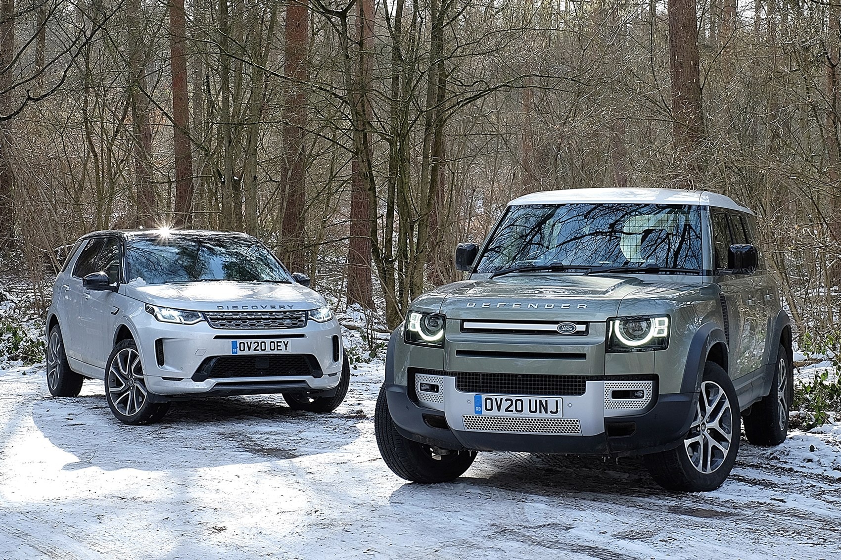 Land Rover Defender and a Land Rover Discovery Sport