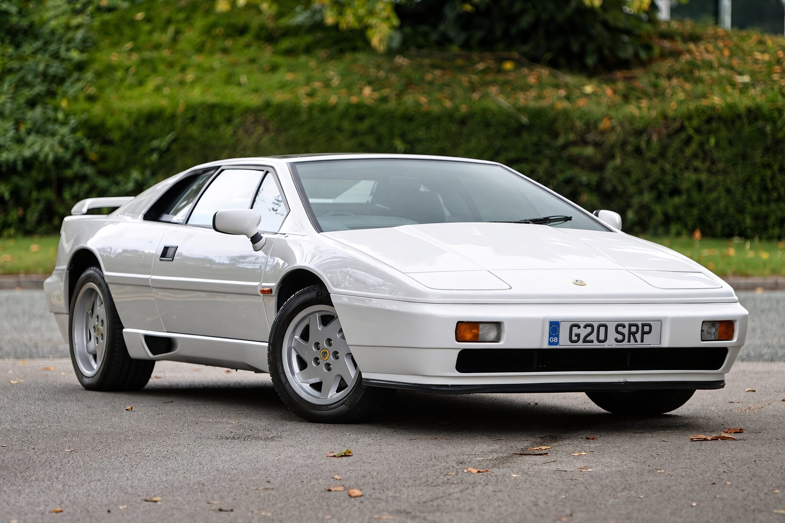 Classic Lotus Esprit sports car parked outdoors, showcasing its sleek wedge-shaped design