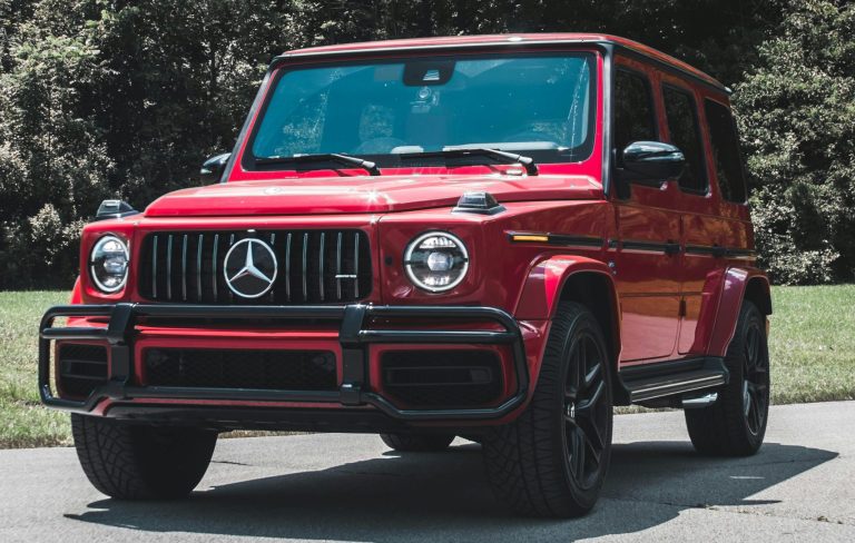 A G-Wagon is standing on a road on a sunny day