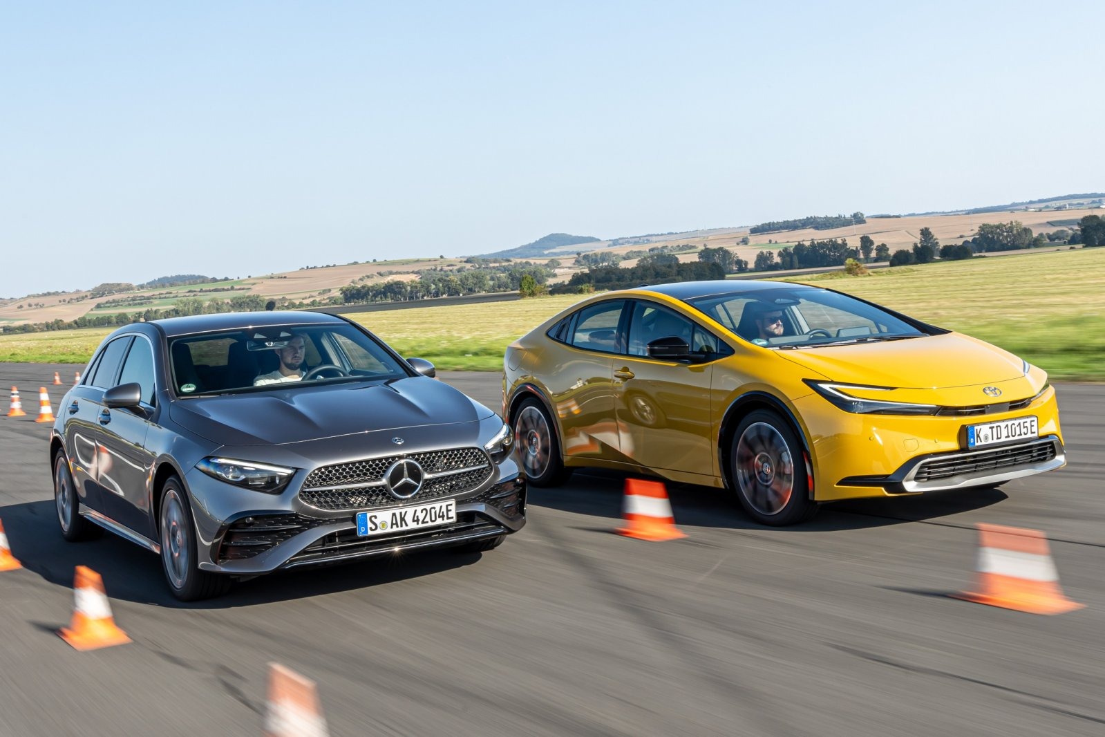 Mercedes-Benz A-Class sedan and a Toyota Prius
