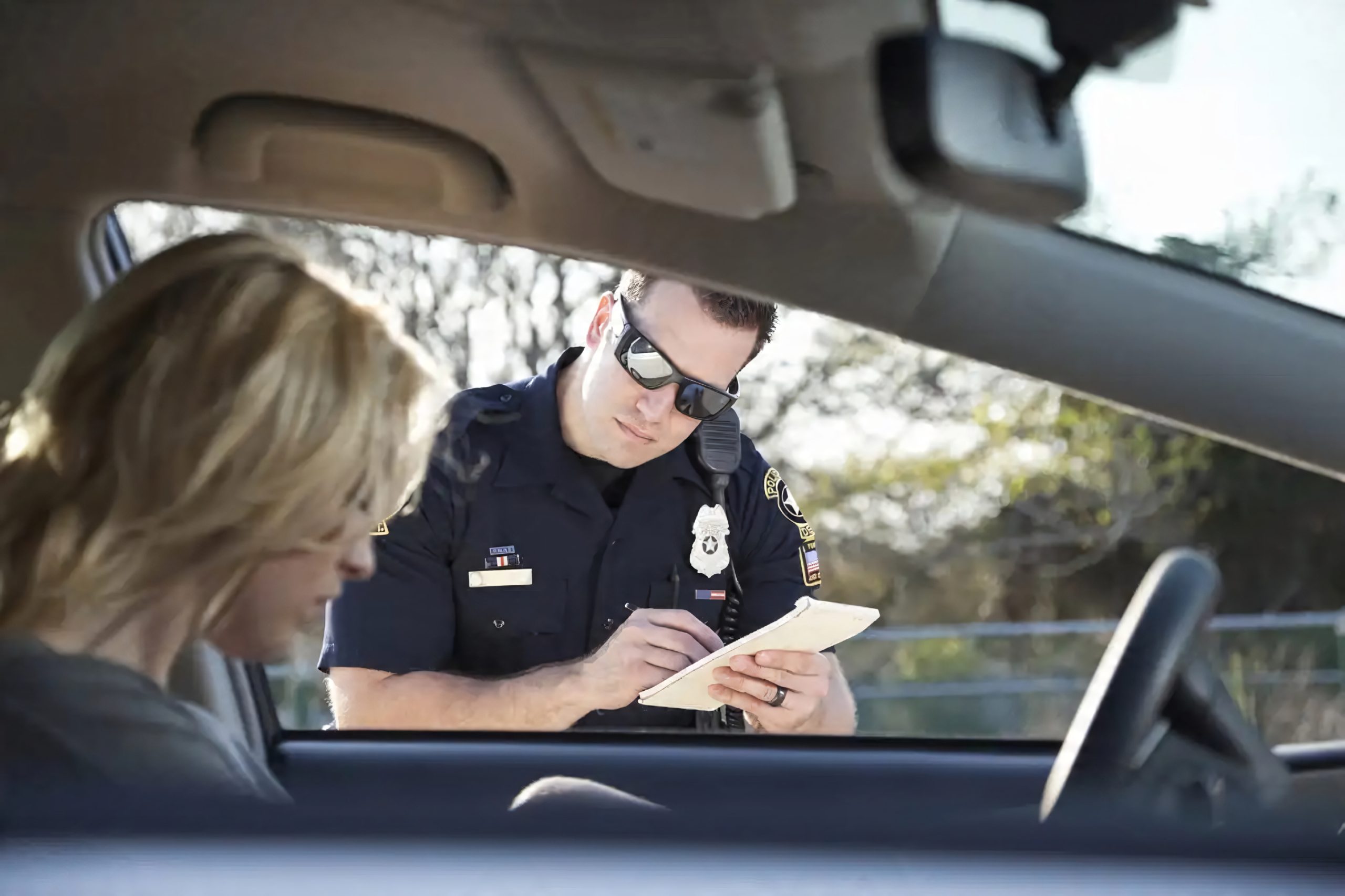 Police officer writing a citation
