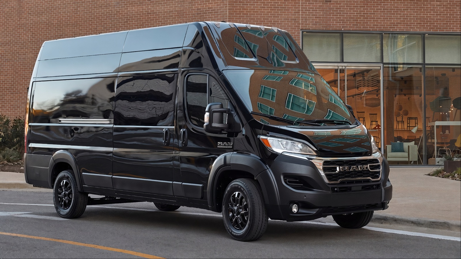 Ram ProMaster Cargo Van parked outside a modern commercial building on a city street