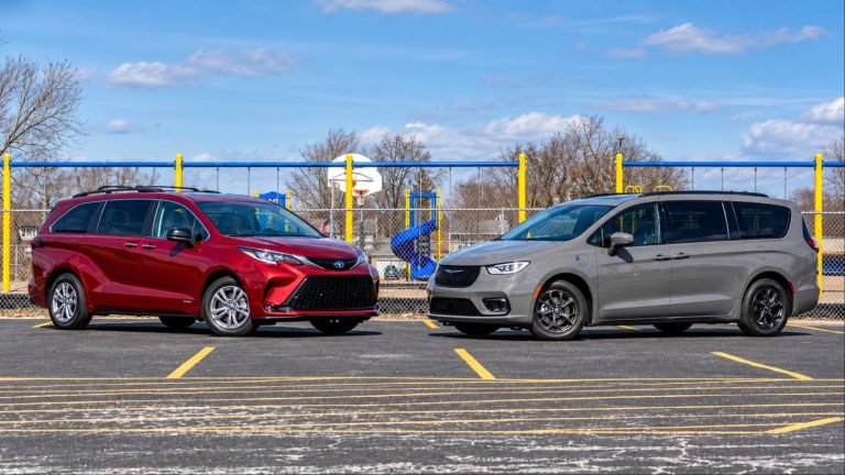 Toyota Sienna and Chrysler Pacifica hybrids parked side by side at school