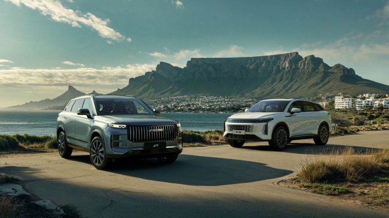 Two JAECOO SUVs parked beside Cape Town coastline beneath dramatic Table Mountain