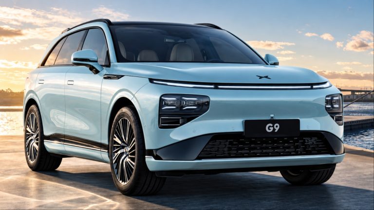 XPeng G9 SUV parked beside a waterfront, with modern styling and evening sunlight